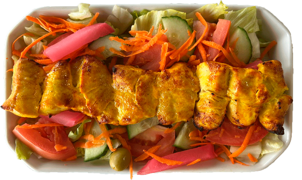 chicken kebab on salad