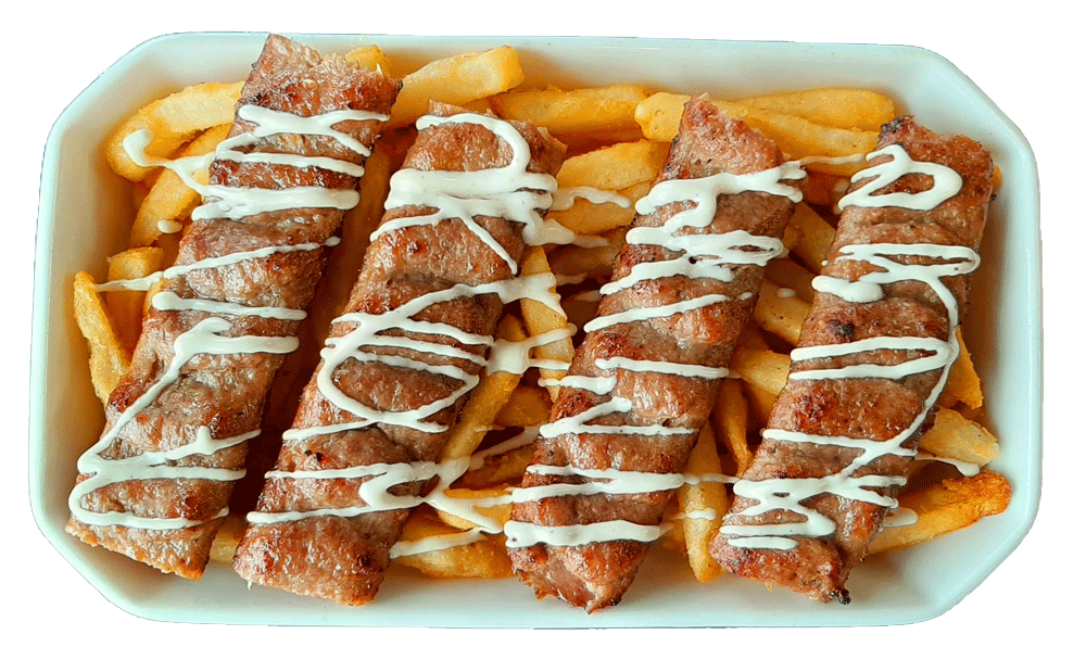 beef kebob arranged on fries with garlic sauce